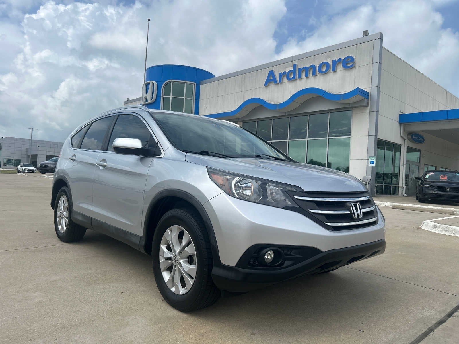 2014 Honda CR-V EX-L in Alabaster Silver Metallic — front three-quarter view