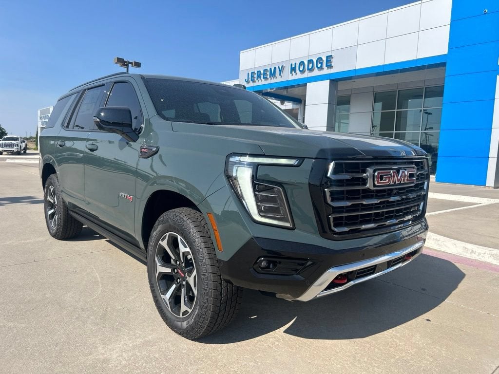 2026 GMC Yukon AT4 in Midnight Pine — front three-quarter view