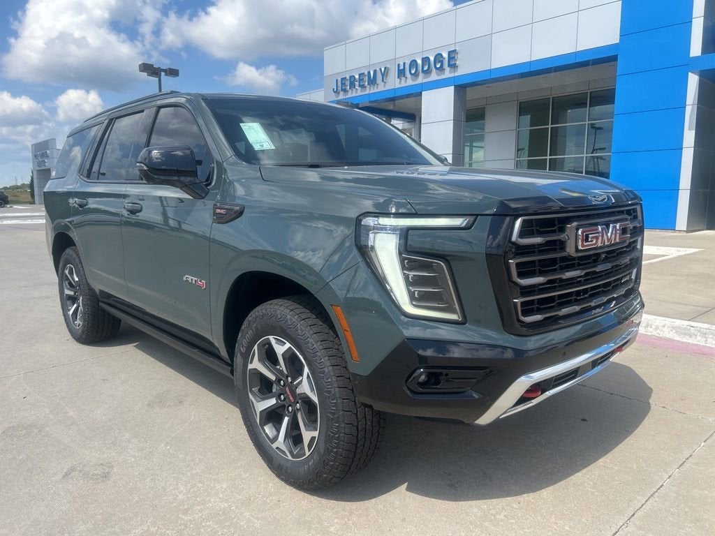 2026 GMC Yukon AT4 Ultimate in Midnight Pine — front three-quarter view