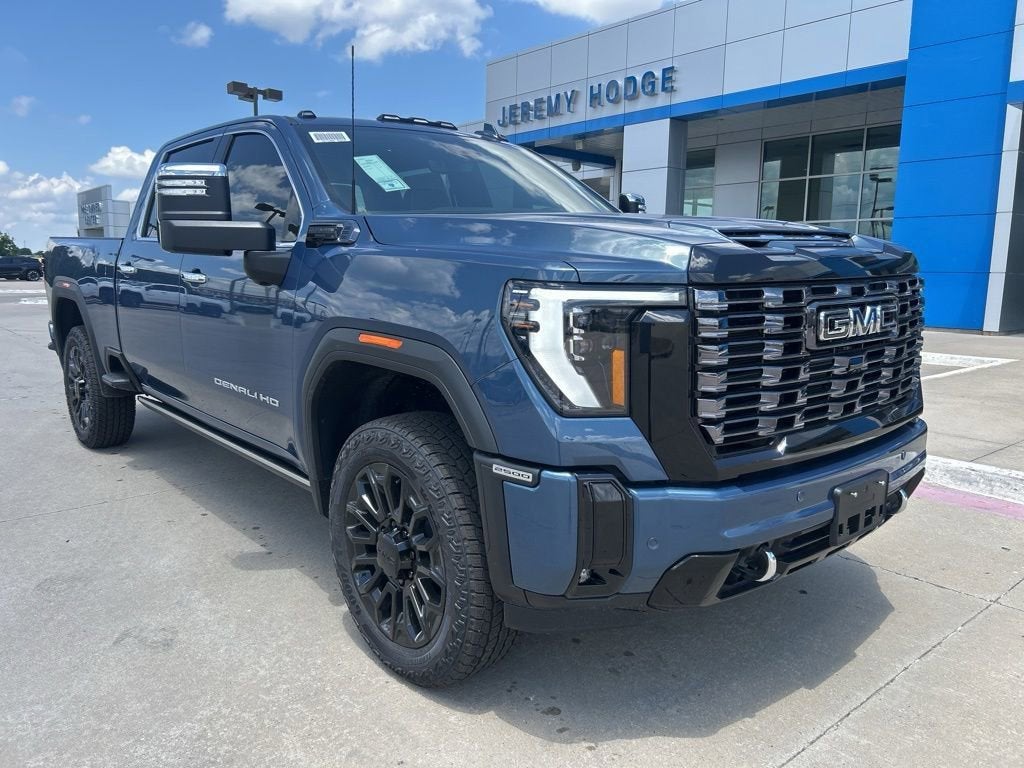 2026 GMC Sierra 2500 HD Denali Ultimate in Downpour Metallic — front three-quarter view